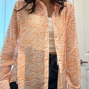 Peach/orange sheer zebra print button up blouse from princess polly